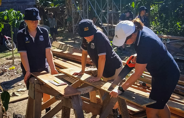 School students preparing to build a house with VBC